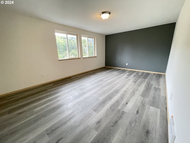 empty room with wood-type flooring