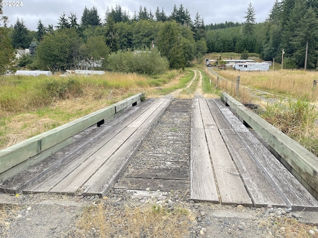 exterior space featuring a wooded view