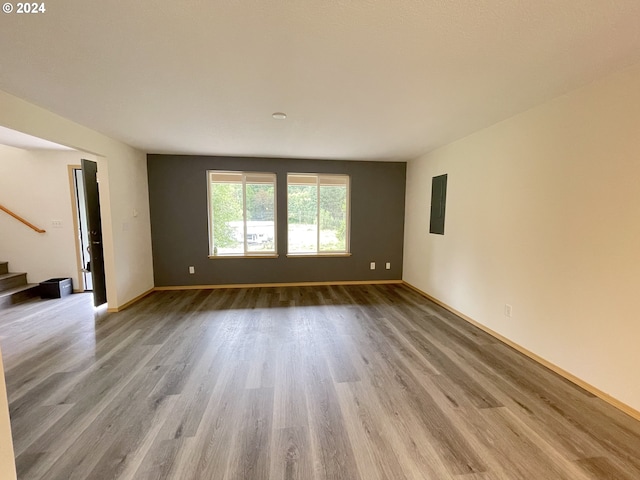 unfurnished room with light wood-type flooring