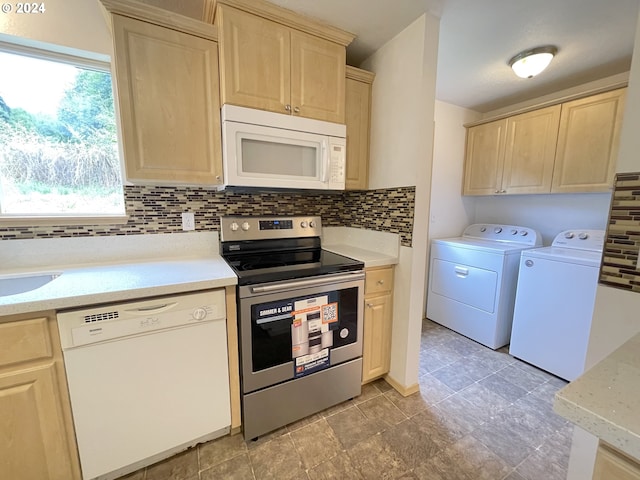 kitchen featuring decorative backsplash, white appliances, light brown cabinetry, and washer and clothes dryer