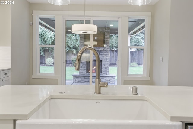 interior details featuring pendant lighting and sink