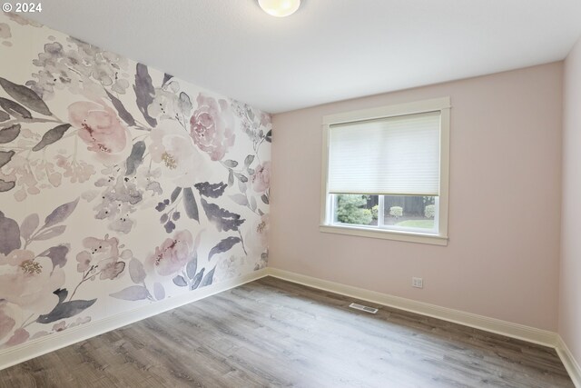 empty room featuring hardwood / wood-style flooring