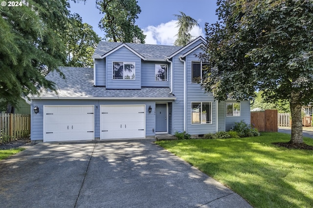 view of front of house with a garage and a front lawn