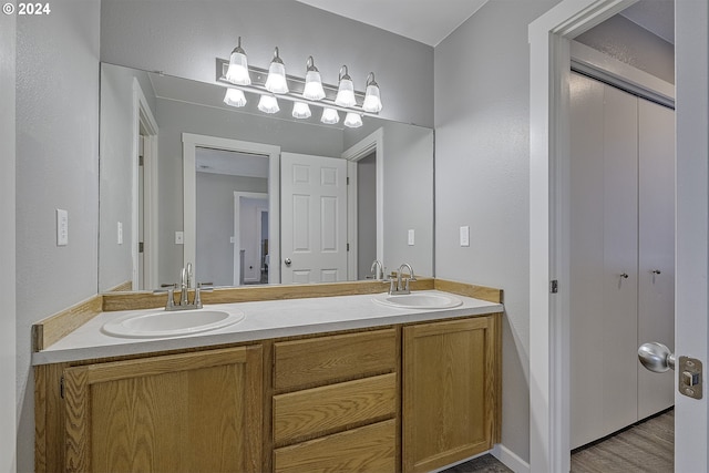 bathroom featuring hardwood / wood-style flooring and vanity