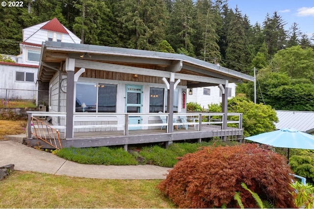 exterior space featuring a wooden deck