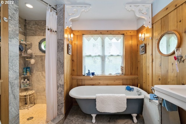 12880 Hobsonville Point Dr, Bay City, OR 97107 - bathroom featuring tiled shower, a freestanding tub, and wooden walls
