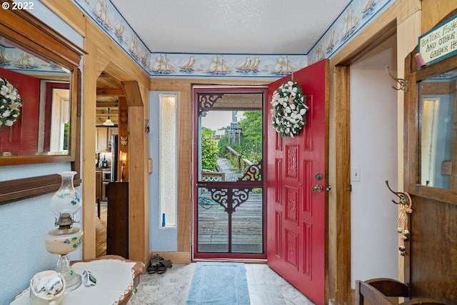 entrance foyer featuring a textured ceiling