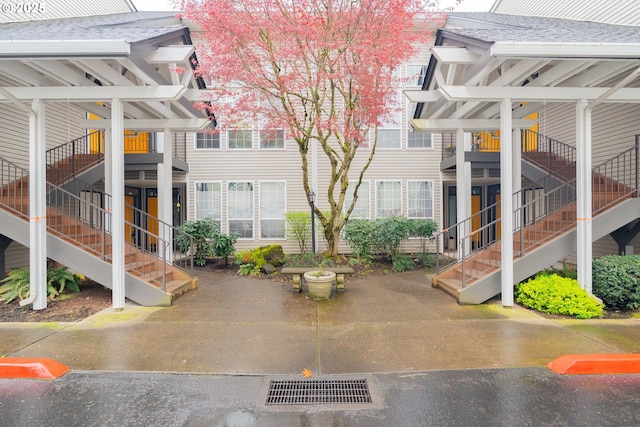 view of community featuring visible vents and stairs