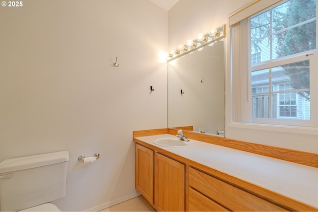bathroom with toilet and vanity