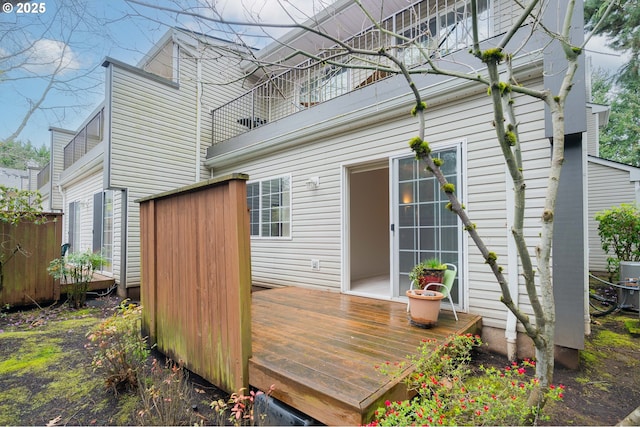 rear view of property with a wooden deck