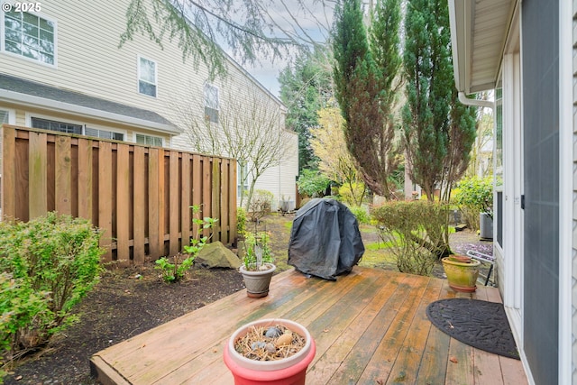 deck featuring a grill and fence