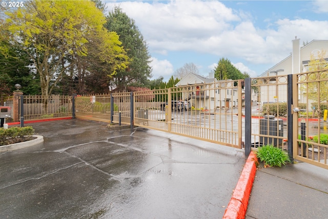 view of gate featuring fence