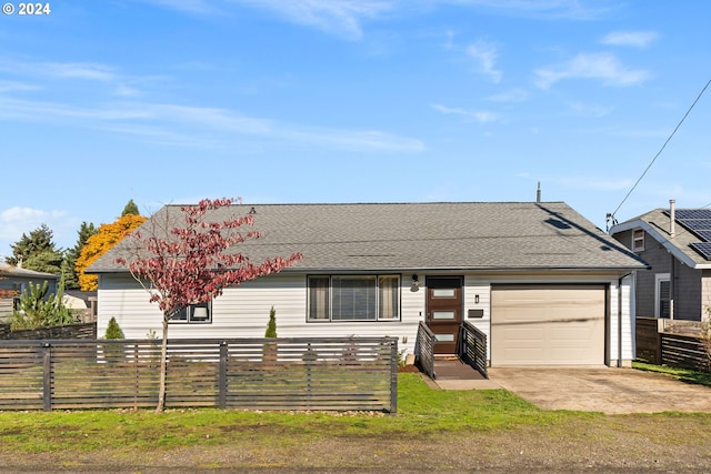 ranch-style home featuring a garage