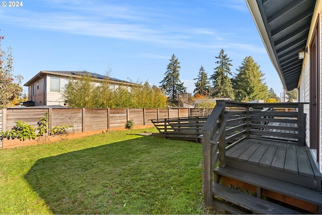 view of yard with a wooden deck