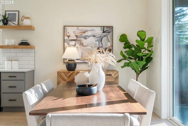 dining space with light wood-type flooring