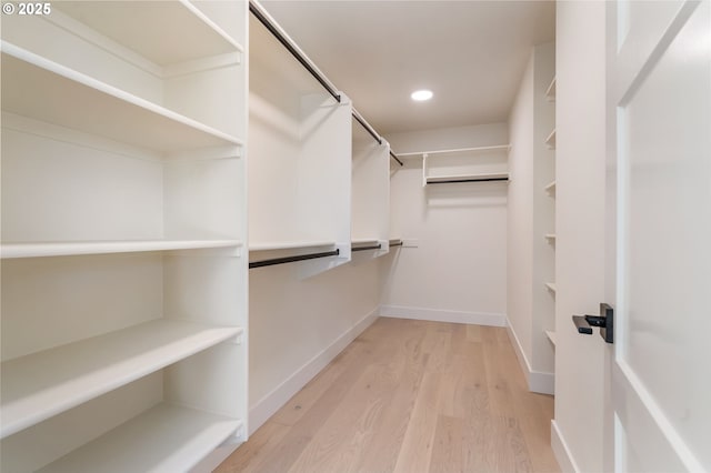 walk in closet featuring light wood-style flooring