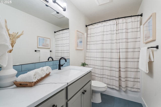 full bath with shower / bath combination with curtain, vanity, toilet, and tile patterned floors