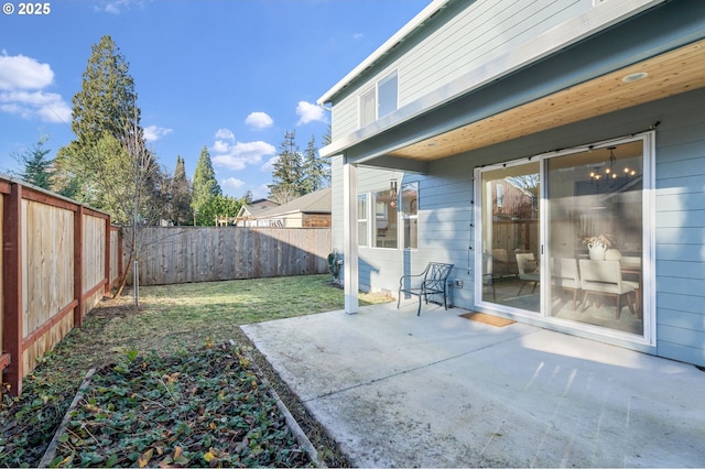 view of yard with a fenced backyard and a patio