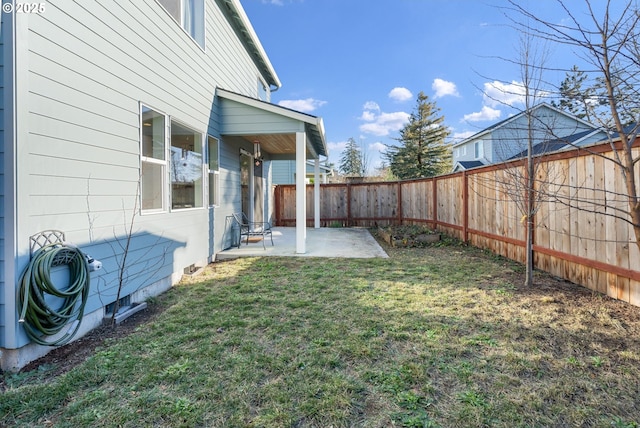 view of yard with a patio area and a fenced backyard