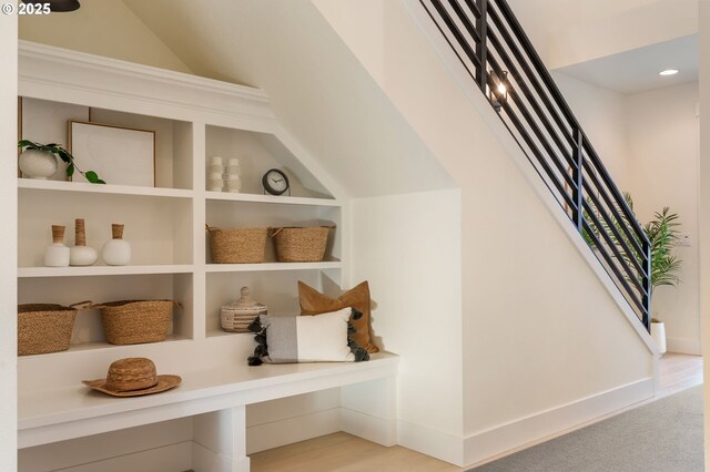 staircase featuring hardwood / wood-style flooring