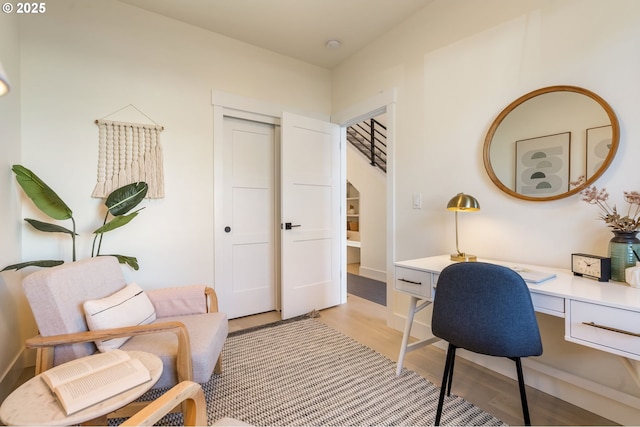 home office with light wood-style floors