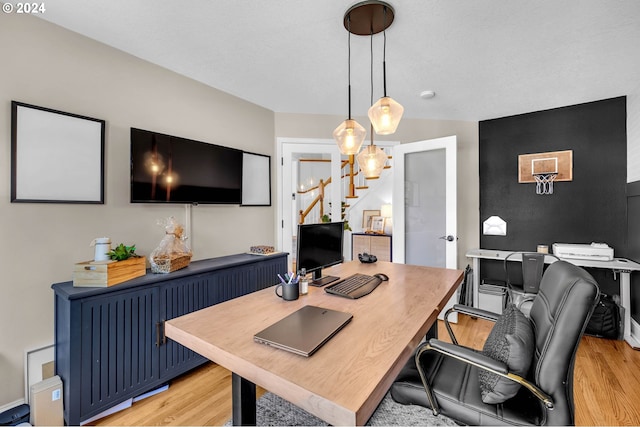 office area with light wood-type flooring, radiator heating unit, and french doors