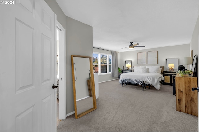 bedroom with ceiling fan and light colored carpet