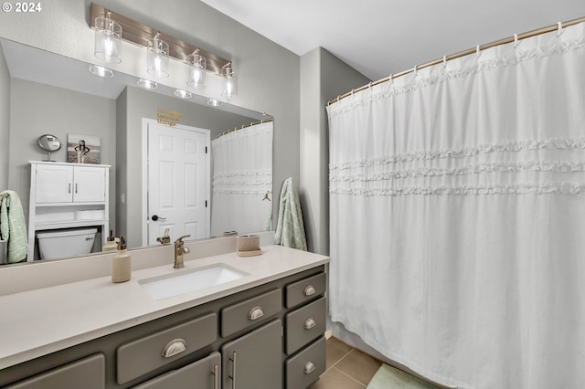 bathroom with tile patterned flooring and vanity