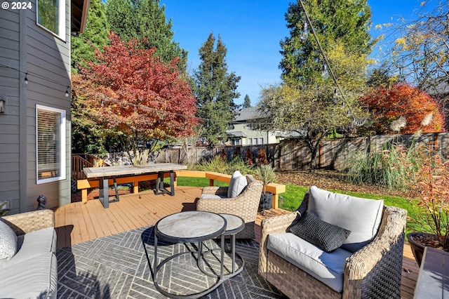 wooden terrace featuring an outdoor living space