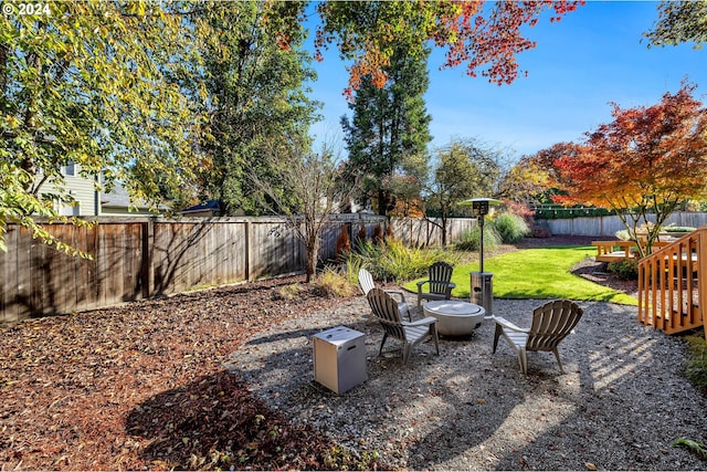 view of yard with an outdoor fire pit