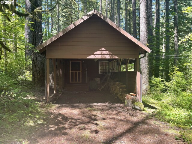 view of outbuilding with covered porch