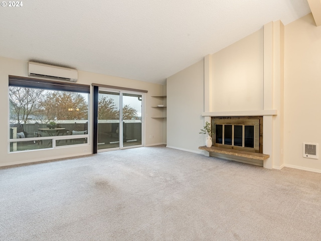 unfurnished living room featuring high vaulted ceiling, carpet floors, a wall mounted air conditioner, and a textured ceiling