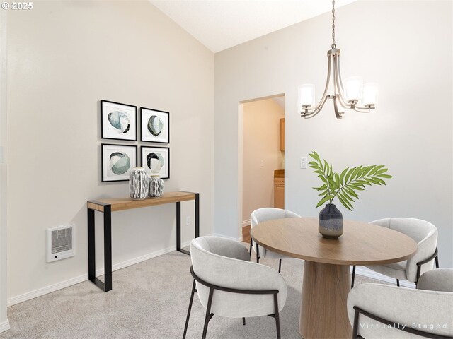 dining area with an inviting chandelier, light colored carpet, vaulted ceiling, and heating unit