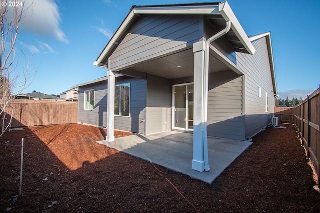 back of property featuring a patio and central air condition unit