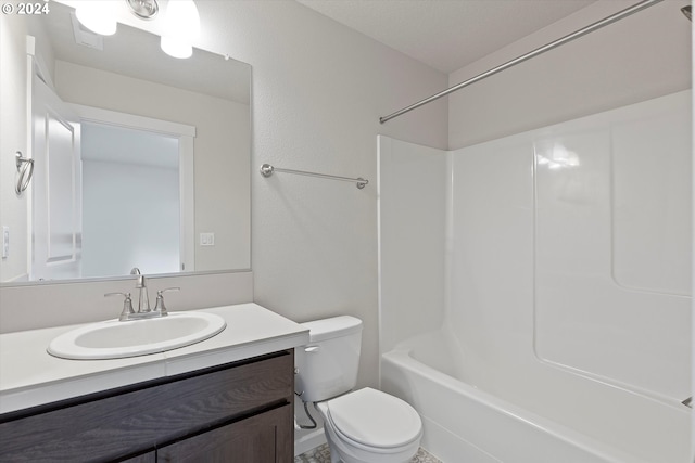 bathroom with shower / tub combination, vanity, and toilet