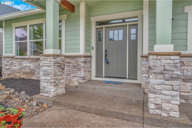 doorway to property featuring a porch