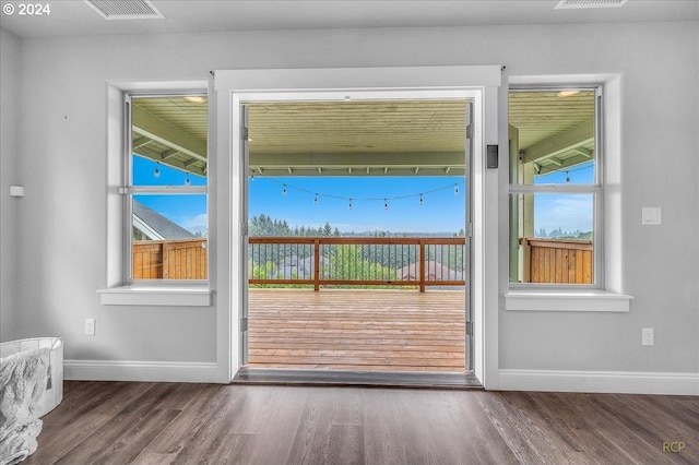 doorway to outside featuring hardwood / wood-style flooring