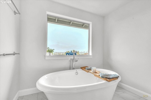 bathroom with a tub to relax in