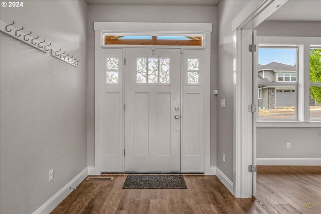 spare room with dark wood-type flooring and a textured ceiling