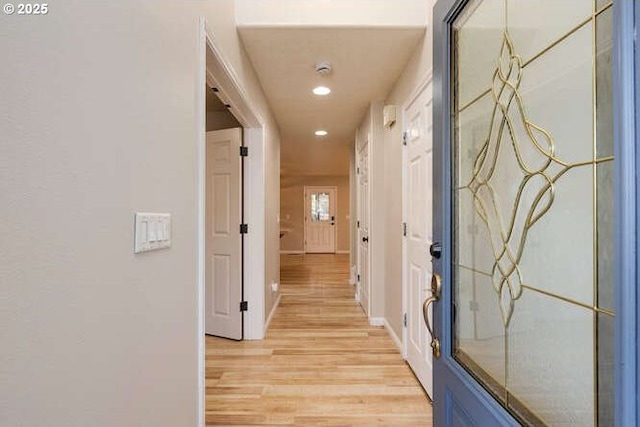 hall with light wood-type flooring