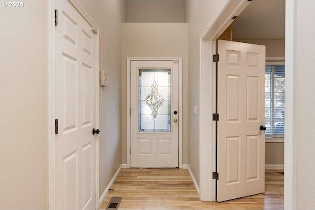 doorway with light hardwood / wood-style flooring