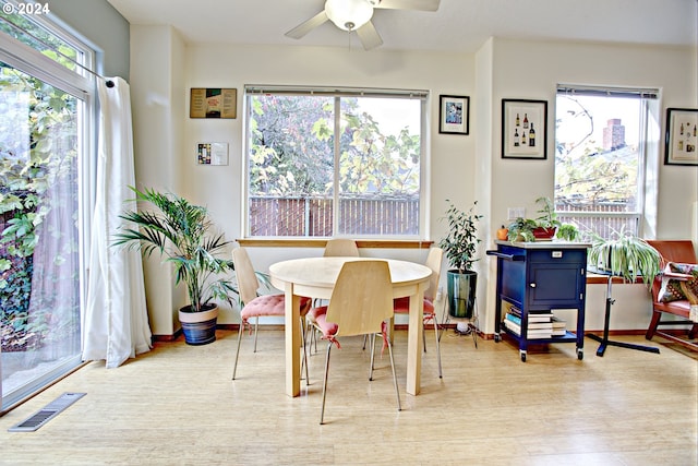 dining room featuring light hardwood / wood-style flooring and ceiling fan