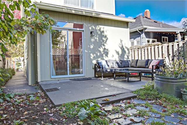 property entrance featuring a patio and an outdoor hangout area