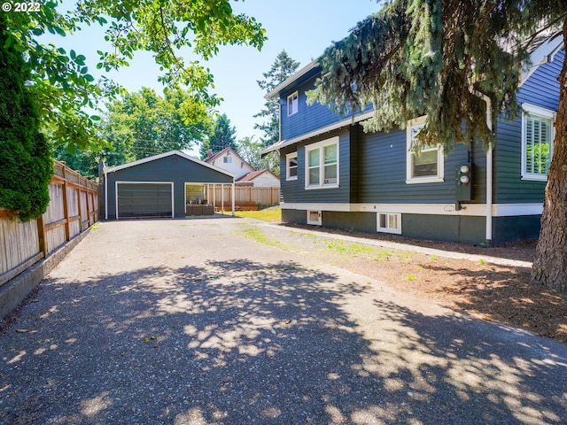 exterior space with an outdoor structure and a garage