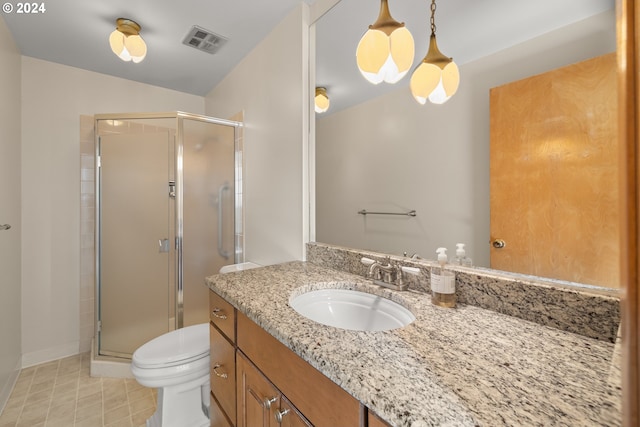 bathroom with toilet, an enclosed shower, and vanity