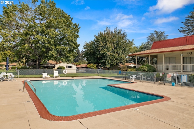 view of swimming pool featuring a patio