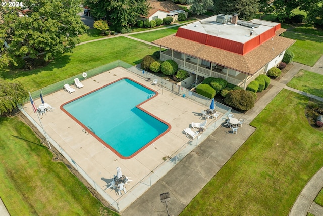 view of pool with a lawn and a patio area