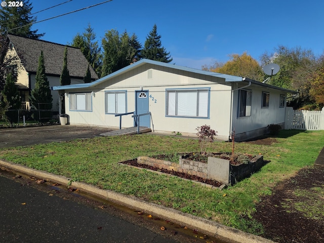 view of front of property with a front lawn