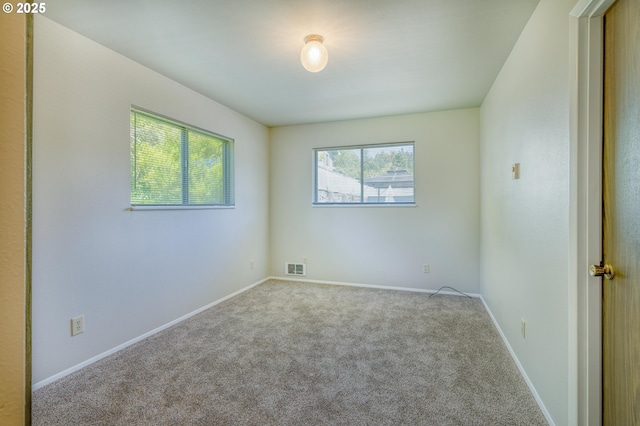 422 E 5th St, Coquille, OR 97423 - spare room featuring carpet flooring and baseboards