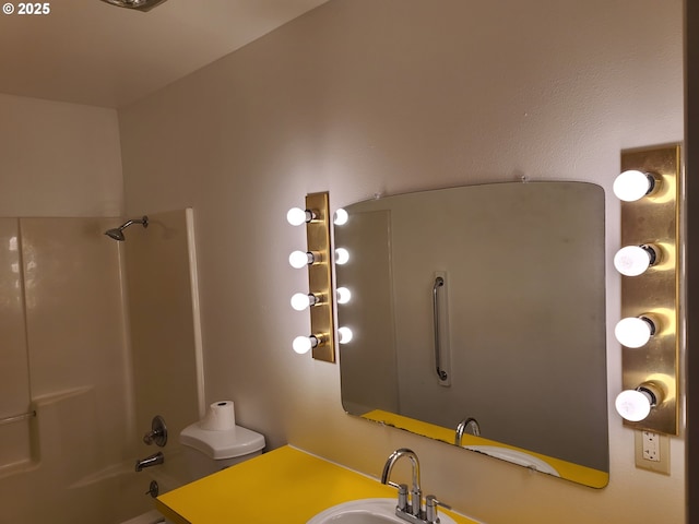 full bathroom featuring bathtub / shower combination, toilet, and sink